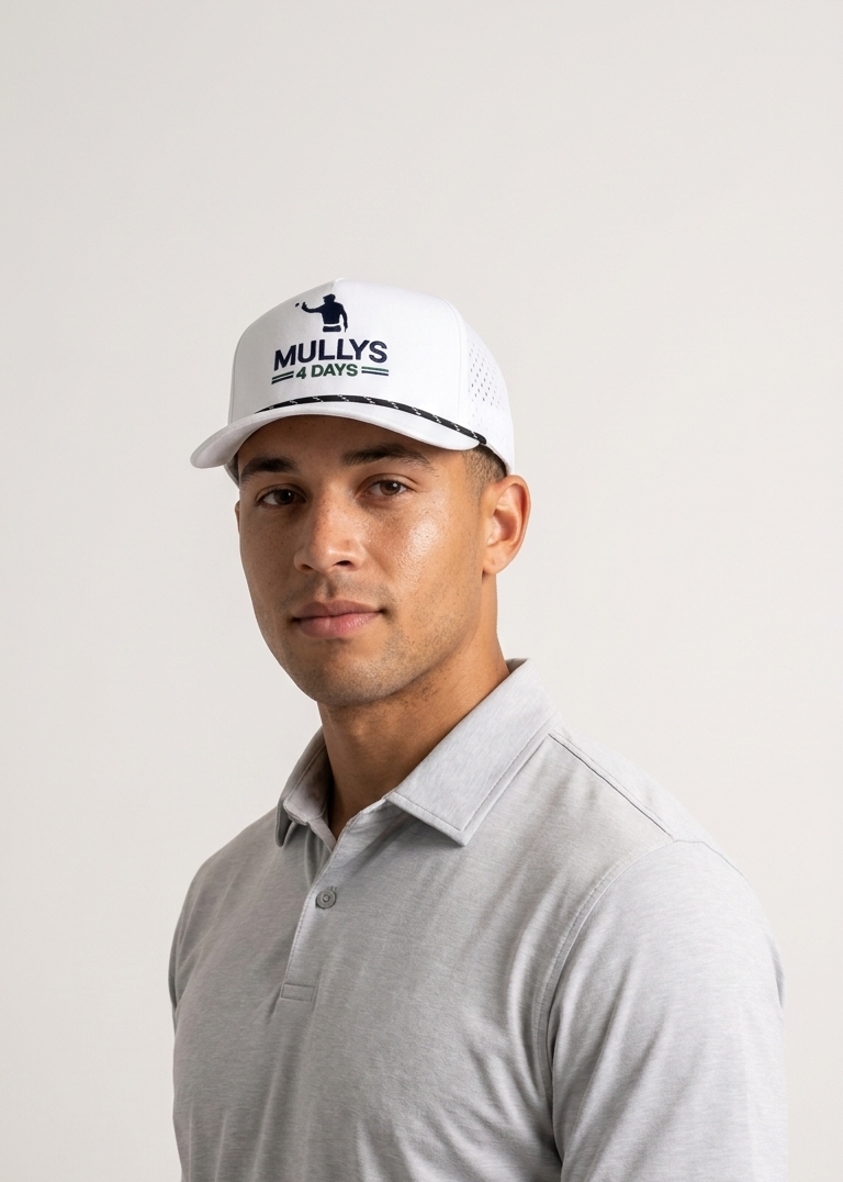 Man wearing a white cap with branding and a gray polo shirt on a light background